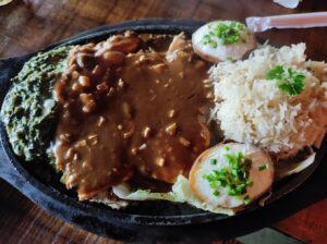 Landour Mussoorie vibe, intimate dining Delhi, vegetarian sizzlers Delhi, exceptional service restaurants, rustic wooden decor, GK1 dining, Delhi cocktail bar, kid-friendly cafes Delhi